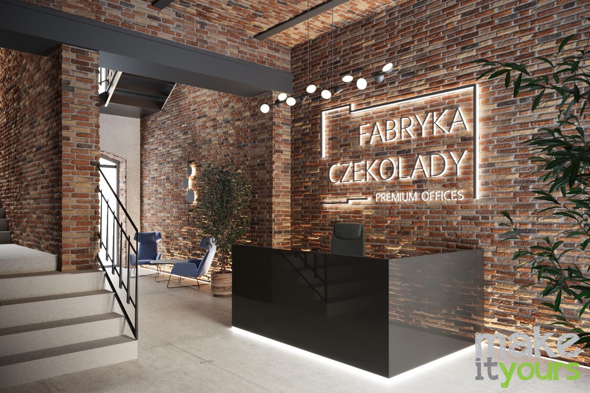 Zdjęcie przedstawia recepcję w kompleksie biurowym Fabryka czekolady w Katowicach zaprojektowaną przez studio projektowe Make It Yours