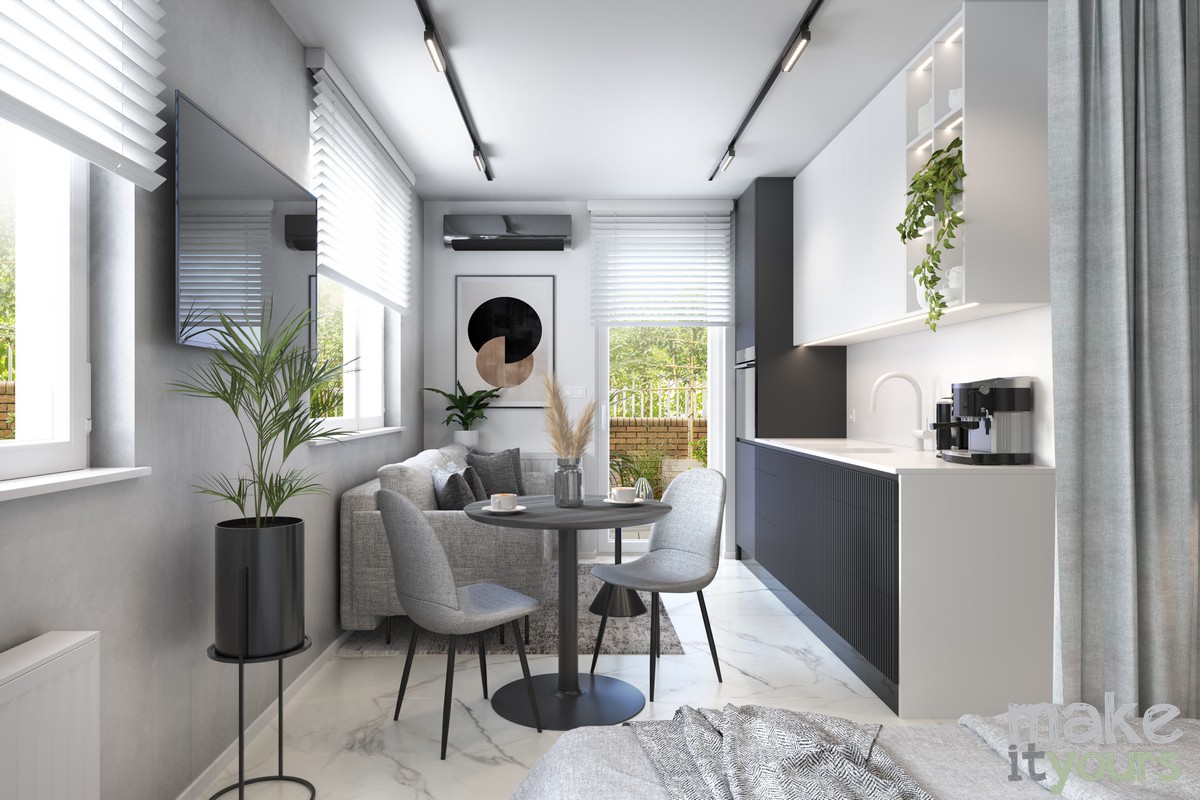 Zdjęcie przedstawia widok na salon z kuchnia. To Projekt mieszkania 30m2 od Pracowni Make It Yours z Krakowa